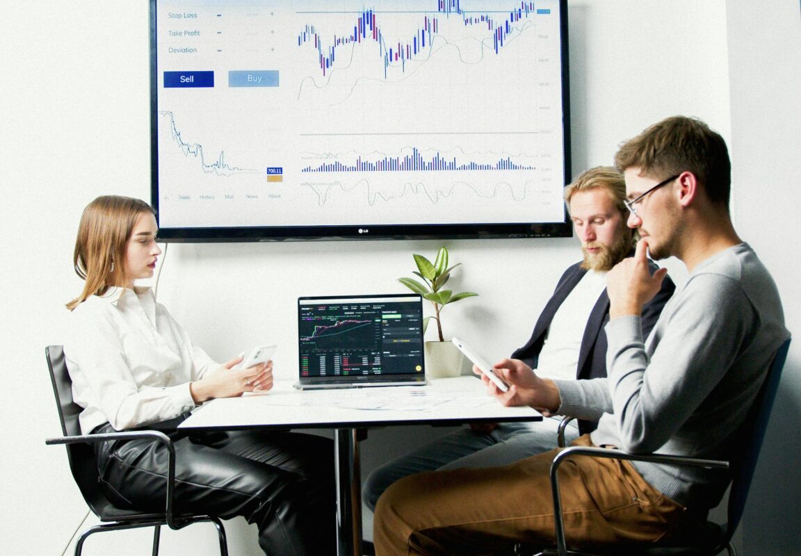 Team analyzing performance charts and graphs