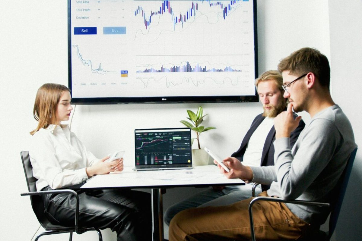 Team analyzing performance charts and graphs